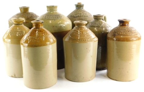 AA collection of stoneware flagons, names all relating to Lincolnshire, to include Tadcaster Tower Brewery Company Wine Merchants, Brigg and Scunthorpe, Shaw, Spilsby, Lowe Son and Cobbold Stamford, Pashley, Gainsborough, Allison, Louth, etc. (AF) (8)