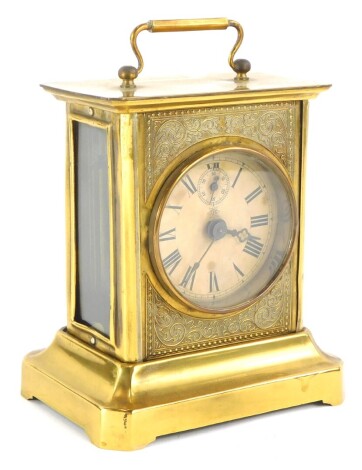 A German Junghans pressed brass carriage clock, with paper dial and loop handle, 19cm high.