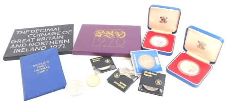 Two 1977 silver proof crowns, various nickel silver crowns, and two annual coin sets.