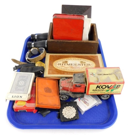 Miscellaneous items, to include a late tin plate toy money box, dress watches, cloth badges, three postcards, cigars, etc.