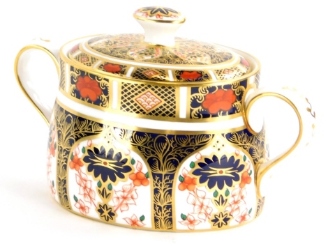 A Royal Crown Derby porcelain two handled sugar bowl and cover, decorated with the 1128 Imari pattern.