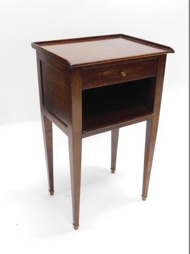 A mahogany bedside table, with a raised gallery, single drawer above a recess, on square tapering legs with brass feet, 39cm wide.