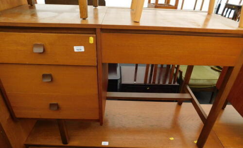 A teak Symbol dressing table, 72cm high, 107cm wide, 42cm deep.