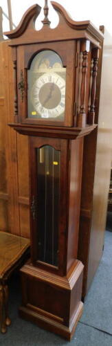 An Emperor grandmother clock, with brass face and Arabic numerals, with weights and pendulum.