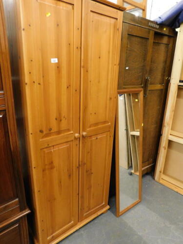 A pine double wardrobe, an oak double double wardrobe and a stool.