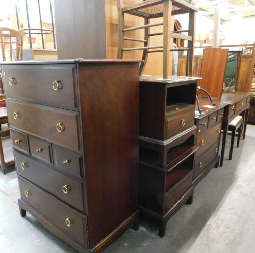 A Stag Minstrel part bedroom suite, to include two door wardrobe, bedside cabinets, chest of drawers, mirror back dressing table, etc. (a quantity)