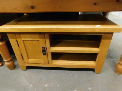 A modern light oak low cabinet, with a single hinged door and inner shelf, 50cm high, 90cm wide, 45cm deep.