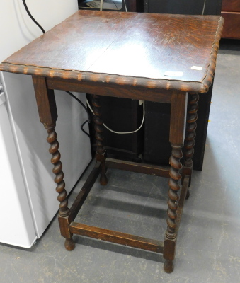 An oak occasional table, with a square top, with pie crust border, on barley twist legs, the top 49cm x 50cm.