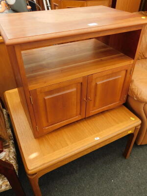 A square topped coffee table, and a pine cabinet, with two hinged doors to the base.