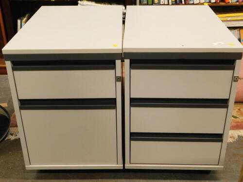 A pair of office filing drawers.