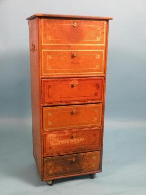 A French gilt tooled leather veneered chest