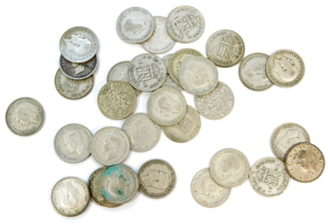 A quantity of mainly silver sixpences.