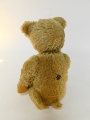 A Schuco model of a Tricky Teddy Bear, with golden mohair, moveable head and tail, silk and plastic tags, wind-up movement, 53cm high. (AF) - 3