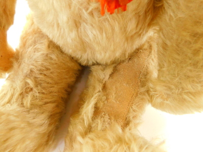 A Schuco model of a Tricky Teddy Bear, with golden mohair, moveable head and tail, silk and plastic tags, wind-up movement, 53cm high. (AF) - 4