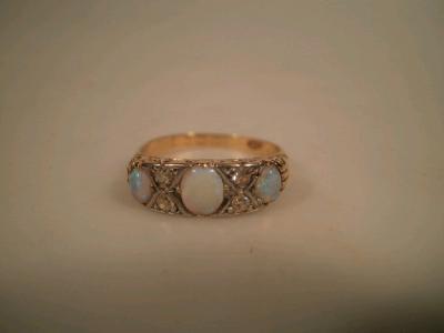 An early 20thC diamond and opal set 18ct gold dress ring