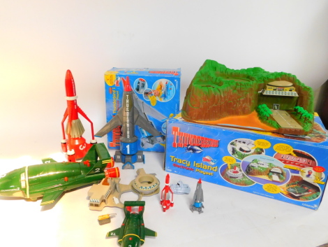 A Carlton Thunderbirds Tracey Island electronic play set, Thunderbird 1 electronic play set, both boxed, T2 and other space craft. (a quantity)