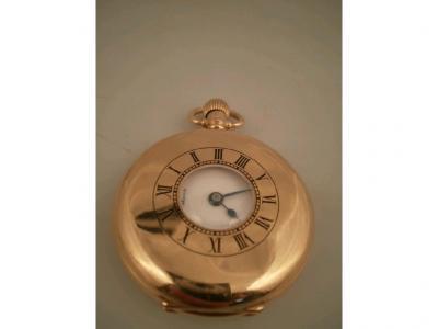 A George V Omega 18ct gold Dennison cased half Hunter pocket watch with bezel wind