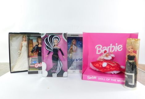 A Pedigree Sindy Doll, Best Selling Girl's Toy 1984., Barbie Doll of The Month, cased., Carolina Herrera Bride., Diva Collection Non Platinum., Grease 25 Years., and 45th Anniversary Doll, all boxed. (6)