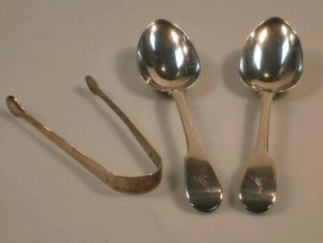 A pair of George III silver fiddle pattern serving spoons