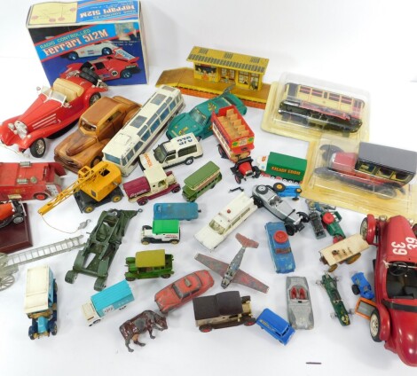 Die cast and other vehicles, including a Dinky mobile crane, Vega Major luxury coach, a Joytown Booking Hall, radio controlled Ferrari 512M, clockwork cable car and vintage taxi, etc. (a quantity)