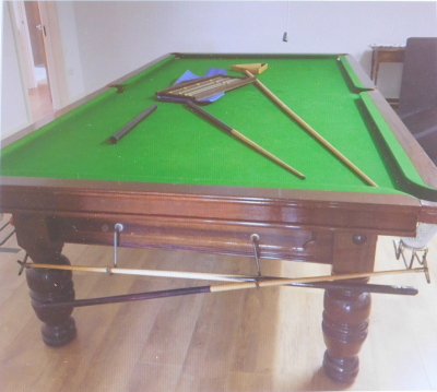 A three quarter size mahogany and slate snooker table, with an added dining table cover, turned legs, cues, accessories, score board, etc. - 2