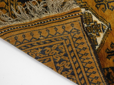 An Afghan rug, with a design of two medallions, on a brown ground, 60cm x 94cm. - 3