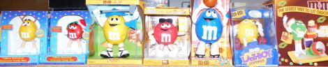 M & M figures, to include chocolate dispensers, talking animated Christmas candy dishes, FM/AM radio, etc., all boxed. (7)