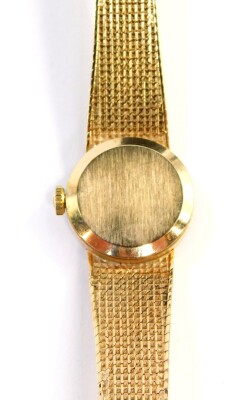 A 9ct gold Tissot lady's wristwatch, with gold coloured small dial, on a bark effect bracelet, the dial 1.5cm wide, 15.5cm long, 20.8g all in. - 2