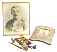 A group of four First World War medals, awarded to a Lieutenant A.E Williams S & T Corp, the 1914-15 Star, the 14-15 Campaign medal, the Victory medal, with dispatches bar and a George V long service and good conduct medal, awarded to a Staff Sergeant A. 