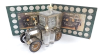 A tinplate Ford vintage car liqueur set and two Historic Car Coin Collections.