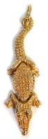 An articulated crocodile pendant, of three body detailing with head main body and tail, yellow metal, unmarked, with pendant loop, 5cm high, 7.1g all in.