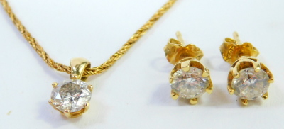 An 18ct gold diamond pendant and earring set, each set with a round brilliant cut diamond, in a six claw basket setting, the stones 5.8 x 5.8 x 2.8, approximately 0.62cts, the necklace on a rope twist chain, 42cm long, 7.7g all in, boxed. - 2