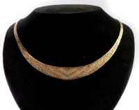 An Eastern inspired tri colour necklace, of layered design, yellow metal stamped 375, with central diamond flared detailing, 13cm wide, 14cm high, 20.9g all in.