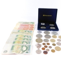 Commemorative crowns and coinage, including a Tower of London one pound coin., Bailiwick of Guernsey 1997, Chinese coin decorated with the Emperor BuYi, Elizabeth II circulated one pound and ten shilling bank notes, and a pendant commemorating the Recover