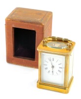 A brass carriage clock, rectangular enamel dial bearing Roman numerals, the case of conventional plain form, with leather outer case, and key, 10.5cm high.