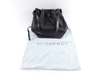 A Burberry check fabric bucket bag, with brown leather trim and shoulder strap and drawstring opening, with dustbag, 30cm high, 30cm wide.
