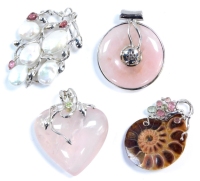 Four stone set pendants, comprising a heart shaped rose quartz silver framed pendant, a rose quartz multi stone set, silver framed circular pendant, an S & Co silver framed cultured pearl and stone set floral pendant, and a fossil silver framed pendant. (