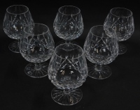 A set of six Waterford crystal brandy balloons decorated in the Lismore pattern.