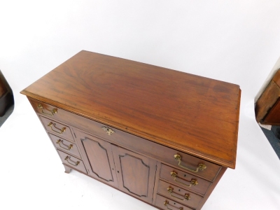 A Georgian style mahogany side cabinet, with a three division long drawer, over a pair of cupboard doors, opening to reveal a single shelf, flanked by six drawers, raised on out swept feet, 86cm high, 107cm wide, 52.5cm deep. - 2