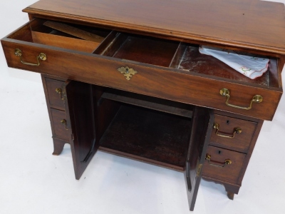 A Georgian style mahogany side cabinet, with a three division long drawer, over a pair of cupboard doors, opening to reveal a single shelf, flanked by six drawers, raised on out swept feet, 86cm high, 107cm wide, 52.5cm deep. - 4