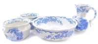 A Masons ironstone blue and white four piece wash set, decorated with fete gallant figures after Watteau, comprising a wash jug and bowl, and pair of chamber pots.