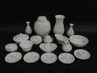 A group of Wedgwood porcelain decorated in the Campion pattern, including a ginger jar and cover, vases, dressing table pots and covers, basket and a candlestick. (a quantity)