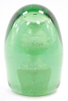 A Victorian green glass and sulphide dump paperweight, decorated with a baluster vase on a plinth, 11.5cm high.