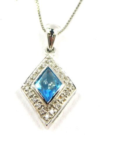 A 14ct white gold blue topaz and diamond pendant, the fancy cut blue topaz in a surround of diamonds, topaz approx 2.33ct, diamonds approx 0.2ct, 7.5g.