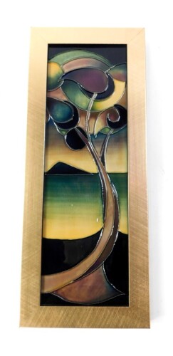 A Moorcroft pottery plaque decorated in the Western Isles pattern, circa 2006, framed, painted and impressed marks, seconds, 30.5cm high, 10cm wide.