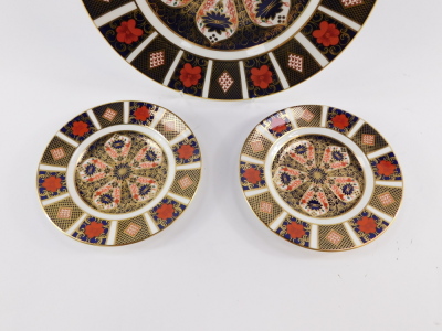 A Royal Crown Derby porcelain dinner plate decorated in the Old Imari pattern, together with a pair of tea plates, seconds, (3) - 2