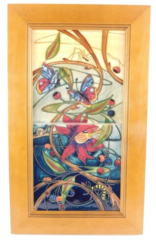 A Moorcroft pottery plaque decorated in the Hartgring pattern, circa 2002, framed, seconds, 41cm high, 20cm wide.