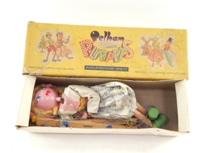 A mid 20thC Pelham puppet modelled as Gretel, of articulated form, partially painted, 30cm high. (boxed, af)