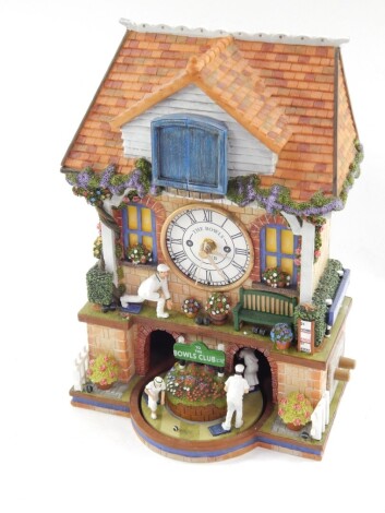 A Bradford Exchange The Spirit of Bowls resin free standing cuckoo clock, marked to the back, 33cm high.