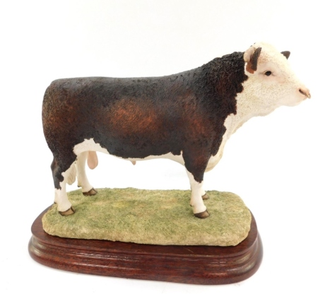 A Border Fine Arts figure modelled as a Hereford Bull, designed by Ayres, BO772, on a wooden base.